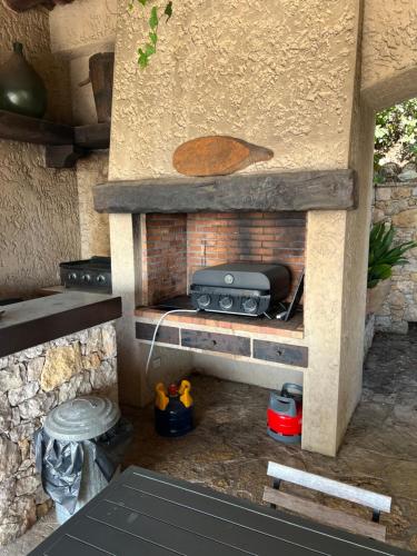 a model of a outdoor kitchen with a brick oven at Villa loucisa Nice piscine vue mer 8 chambres 24 couchages in Nice