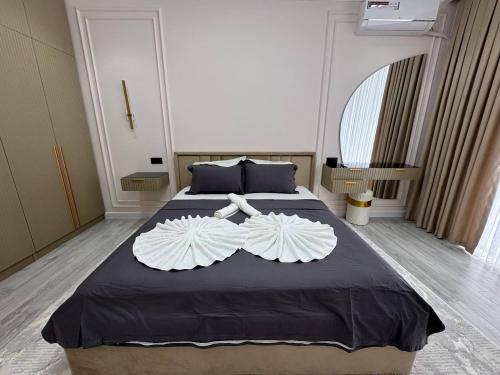 Ένα ή περισσότερα κρεβάτια σε δωμάτιο στο Modern Spaces Tashkent Tower 4