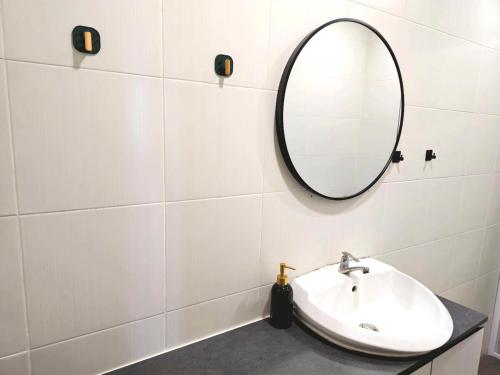 a bathroom with a sink and a mirror on a wall at #MyHillsideHideaway at Quintet, Cameron Highlands in Tanah Rata