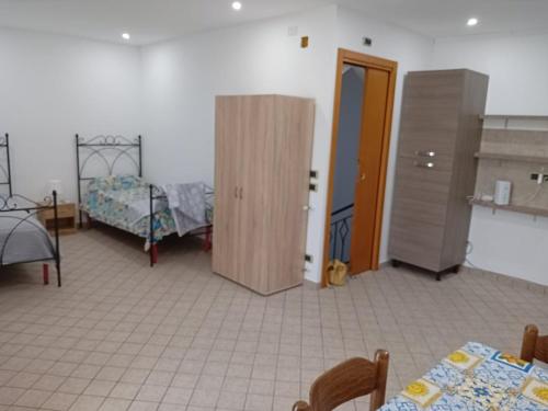 Ένα ή περισσότερα κρεβάτια σε δωμάτιο στο Casa marino monolocale