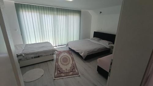 Ein Bett oder Betten in einem Zimmer der Unterkunft Vila AMNA - Ilidža