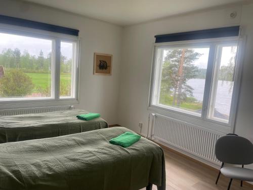 Postel nebo postele na pokoji v ubytování Napapiirin Eräkartano