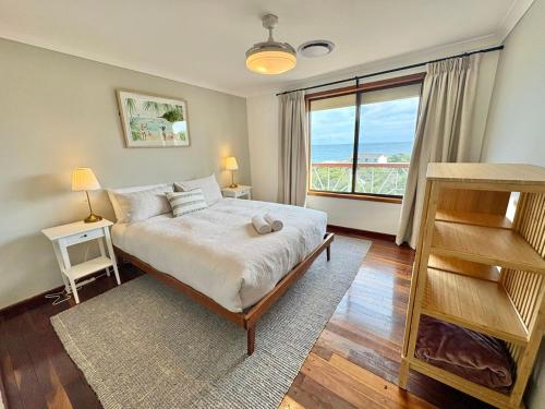 Ένα ή περισσότερα κρεβάτια σε δωμάτιο στο Peppy Beach House