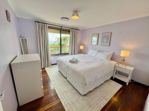 Ένα ή περισσότερα κρεβάτια σε δωμάτιο στο Peppy Beach House