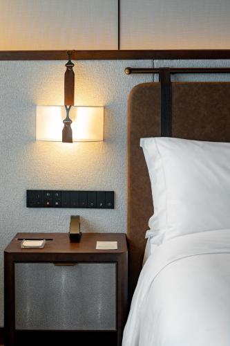 Postel nebo postele na pokoji v ubytování Vignette Collection Shanghai Snow World Hotel by IHG