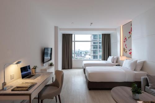 Televisyen dan/atau pusat hiburan di Jasmine 59 Hotel