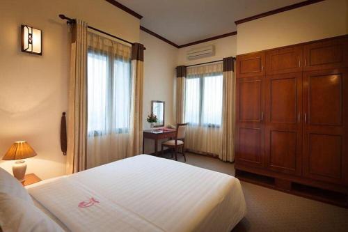 Кровать или кровати в номере CWD Hotel