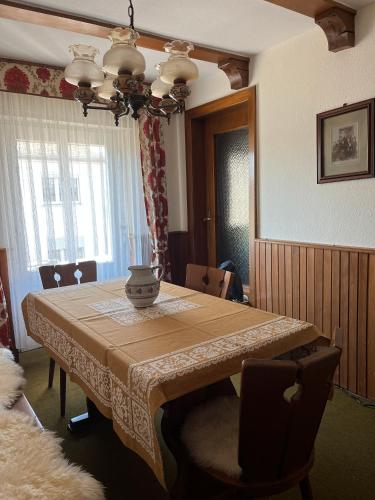 a dining room with a table with chairs and a tableablish at Aale Probierstubb in Weilburg