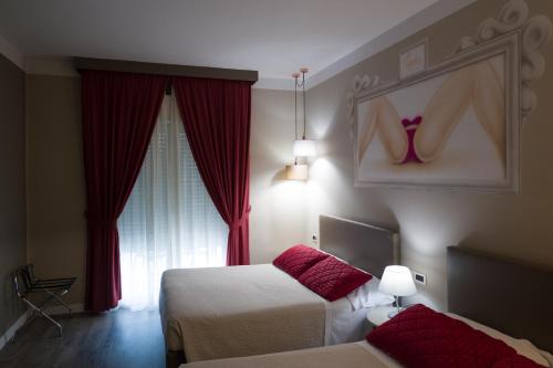 Katil atau katil-katil dalam bilik di Hotel La Gradisca