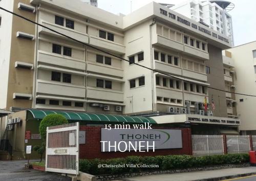a building with a sign in front of it at Tamerin Nest by Chrisenbel Villa Collection in Petaling Jaya