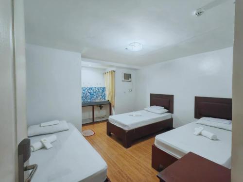 Ένα ή περισσότερα κρεβάτια σε δωμάτιο στο Lemon Residences