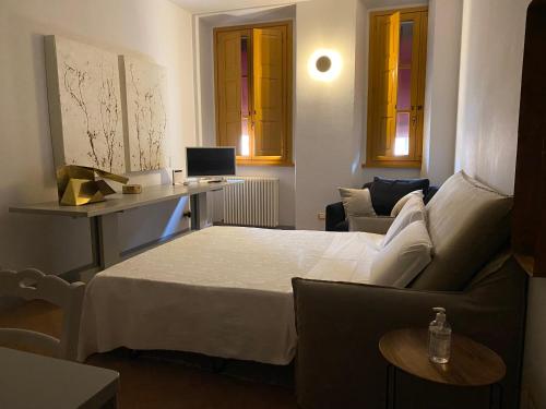 Ένα ή περισσότερα κρεβάτια σε δωμάτιο στο Piccola residenza del Borgo