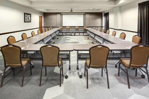 a large conference room with a large table and chairs at Hyatt Place Sacramento Rancho Cordova in Rancho Cordova