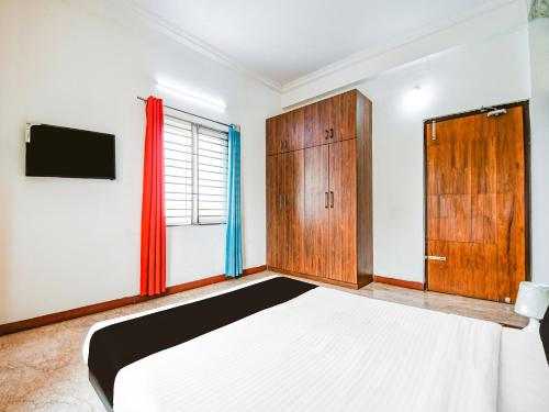 Postel nebo postele na pokoji v ubytování Super Hotel O Kalinganagar