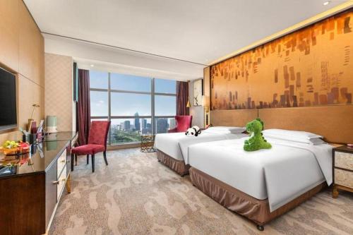 Postel nebo postele na pokoji v ubytování Shijiazhuang Ximeijin Continental Hotel