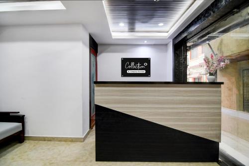 a lobby with a sign on the wall at Super Collection O Chinar Park Near Airport in Kolkata