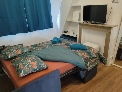 En eller flere senge i et værelse på Studio Rivage