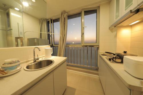 Ванна кімната в Shanghai Suju Service Apartment Pudong Wanda Plaza Zhoupu Subway Station Branch