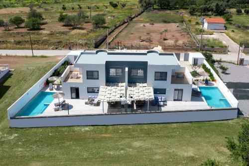 an aerial view of a house with a swimming pool at Villa Vasaltis & Selestitis in Gennadi