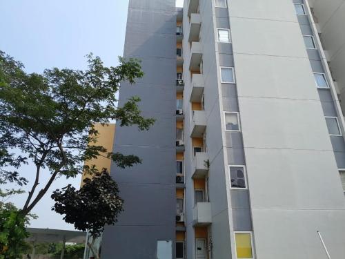 an external view of a building at Smart Inn at Aeropolis Residence in Teko