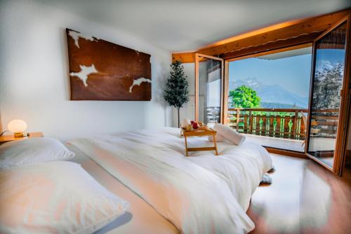 Clouds Apartment Alpin Luxury View and Poolにあるベッド