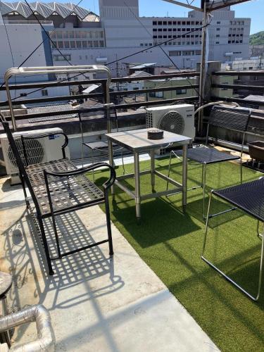 a table and chairs sitting on top of a balcony at Togawa Nojuku - Vacation STAY 80141v in Tuyama
