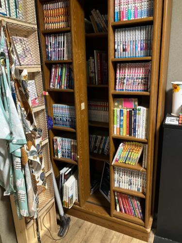 a book shelf filled with lots of dvds at Togawa Nojuku - Vacation STAY 80141v in Tuyama