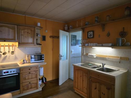 Kuchyň nebo kuchyňský kout v ubytování Gerhards Strandhaus Seaside Bungalow