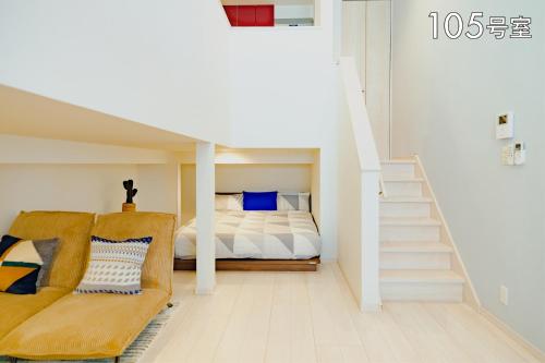 YOUR ROOM 熊本駅 littleにあるベッド