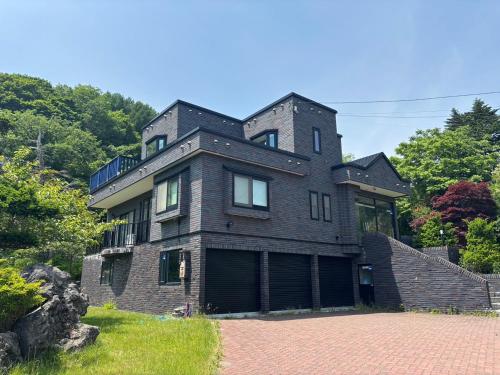 a large brick house on a hill at Senougen in Sapporo
