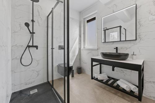 a bathroom with a sink and a shower at Peninsula Villas in Premantura