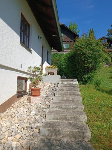 a set of stone stairs leading to a house at Ferienwohnung am Traunsee in Eck