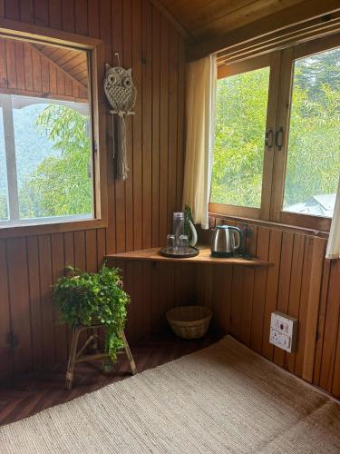 Příslušenství pro přípravu čaje a kávy v ubytování Euphoria Shangarh - Hostel