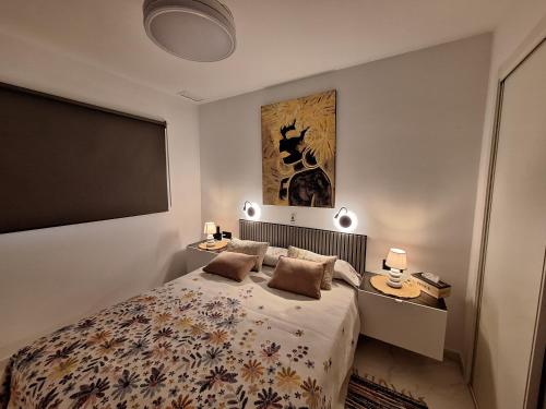 a bedroom with a bed with two pillows on it at Cocoonly in San Juan de los Terreros