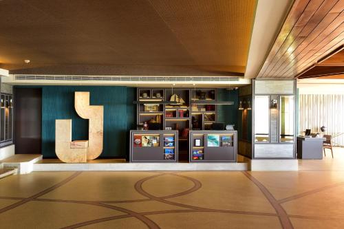 a lobby with a large letter j on the wall at Pestana Alvor Praia Premium Beach & Golf Resort in Alvor