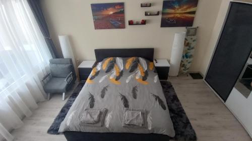 Ένα ή περισσότερα κρεβάτια σε δωμάτιο στο Cosy Apartment