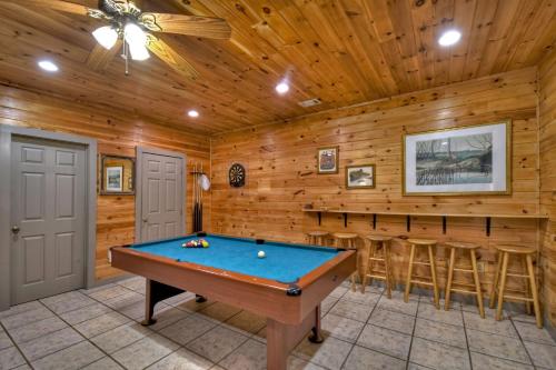 a pool table in a room with a bar at K6 Lodge Gather around the firepit soak in the hot tub and splash in the creek in Blue Ridge