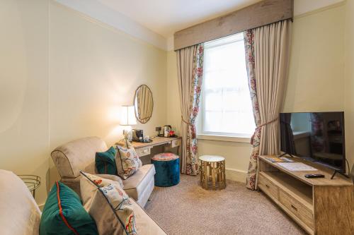 Televisyen dan/atau pusat hiburan di The Swan Hotel, Wells, Somerset - The Coaching Inn Group