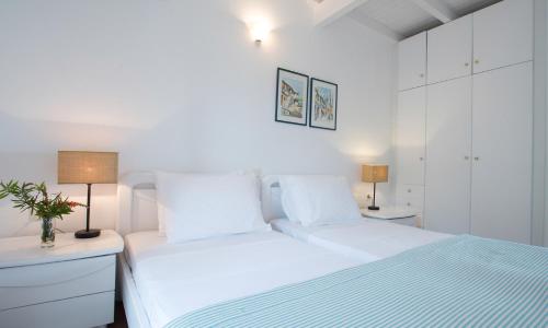 Tempat tidur dalam kamar di Anassa Mare Villas & Residences