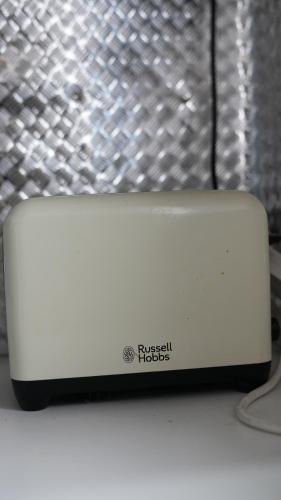 a white router sitting on top of a table at Apartment & Rooms in London in Croydon