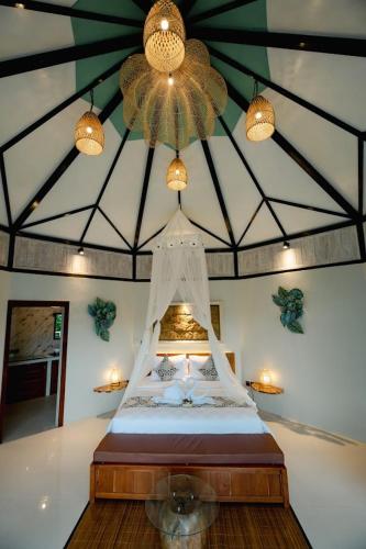 Ένα ή περισσότερα κρεβάτια σε δωμάτιο στο Timbul Highland Villa