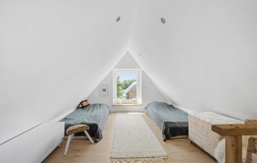 a room with two beds and a window at Stunning Home In Rødekro With Sauna in Rødekro