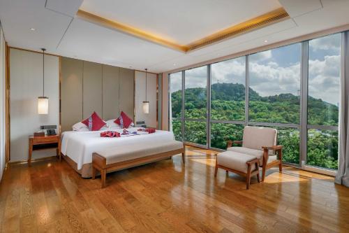 Grand Metro Park Hotel Nanningにあるベッド