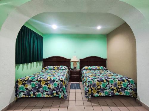 Postel nebo postele na pokoji v ubytování Novotel De Poza Rica
