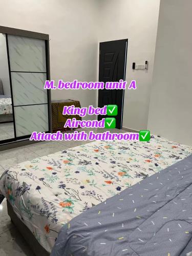 a bed with a king bed attachment in a bedroom at ARZHomeStay unit A in Kuala Terengganu