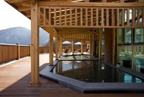 a large building with a swimming pool on a deck at STX Resort in Mungyeong
