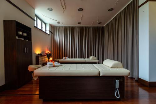 a bedroom with two beds in a room at Grand Sal in Wieliczka
