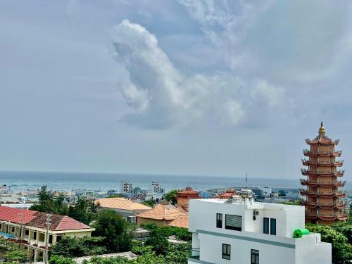 a view of a city with a building and a pagoda at K Hotel Phú Quý in Cu Lao Thu