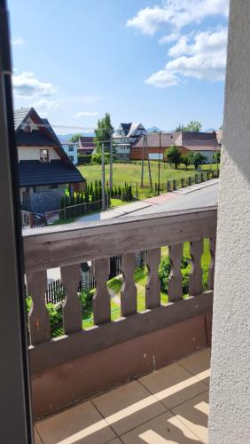 a balcony with a view of a road at Noclegi u Danuty in Groń