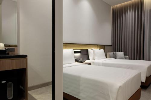 Postel nebo postele na pokoji v ubytování Laska Hotel & Resort Ciater